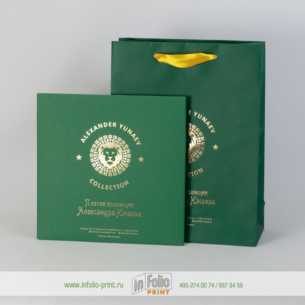 темно-зеленая коробочка с золотым тиснением и пакет